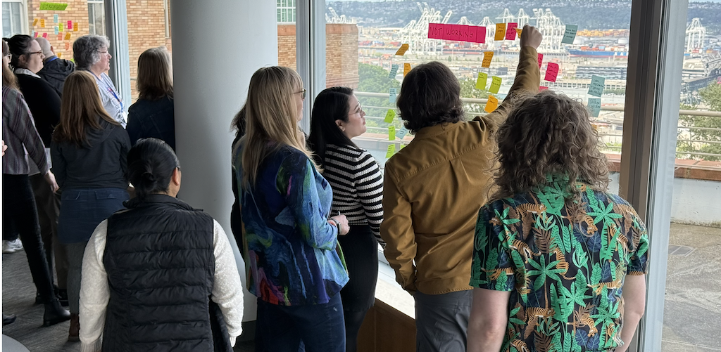 NPSP Day Seattle attendees discussing AI and Salesforce tools